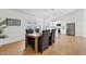 Bright dining room featuring a modern table, seating for six, and seamless flow into the updated kitchen at 6863 W Sunnyside Dr, Peoria, AZ 85345