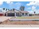 Charming single-story home with manicured lawn, attached garage, and neutral color palette at 6863 W Sunnyside Dr, Peoria, AZ 85345