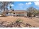 Charming single-story home with a covered front porch and large front yard ready for landscaping at 6863 W Sunnyside Dr, Peoria, AZ 85345