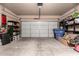 Spacious two car garage with shelving, ample storage space, and overhead lighting at 7015 W Melody Dr, Laveen, AZ 85339