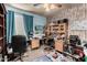 Organized home office with built-in shelving and desk, perfect for remote work or hobbies at 7015 W Melody Dr, Laveen, AZ 85339