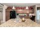A kitchen with granite countertops, stainless steel appliances, decorative accents and ample cabinet space at 7015 W Melody Dr, Laveen, AZ 85339