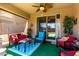 Cozy covered patio with ceiling fan and outdoor furniture, ideal for relaxing or entertaining at 7015 W Melody Dr, Laveen, AZ 85339