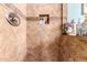 A tiled shower niche complete with stylish fixtures and bathroom accessories at 7015 W Melody Dr, Laveen, AZ 85339