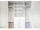 Organized closet featuring built-in shelves, drawers, and ample hanging space for storage at 722 W Topeka Dr, Phoenix, AZ 85027