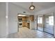 Well-lit kitchen with stainless steel appliances, light cabinets, and adjacent dining area with sliding door at 722 W Topeka Dr, Phoenix, AZ 85027