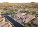 A beautiful neighborhood showcasing the expansive desert landscape and modern single-Gathering homes at 8433 E Leonora St, Mesa, AZ 85207