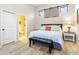 Cozy bedroom featuring a comfortable bed, an ensuite bathroom, and bright lighting at 8433 E Leonora St, Mesa, AZ 85207