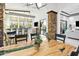 Bright dining area with decorative stone pillars, breakfast bar, and a unique, rustic table at 8433 E Leonora St, Mesa, AZ 85207