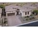 Beautiful single-Gathering home featuring a brick driveway and well-maintained desert landscaping at 8433 E Leonora St, Mesa, AZ 85207