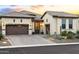 Stunning desert home boasting a tile roof, manicured landscaping, and a charming front entrance at 8433 E Leonora St, Mesa, AZ 85207