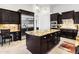 Gourmet kitchen featuring granite countertops, stainless steel appliances, and ample storage space with dark cabinetry at 8433 E Leonora St, Mesa, AZ 85207