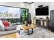 Inviting living room with sliding glass doors to the patio, offering seamless indoor-outdoor living at 8433 E Leonora St, Mesa, AZ 85207