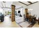 Open-concept living and dining area featuring stone columns and a spacious layout at 8433 E Leonora St, Mesa, AZ 85207