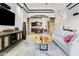 Bright living room seamlessly connects to the dining area with stylish columns and décor at 8433 E Leonora St, Mesa, AZ 85207