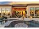 Inviting backyard featuring a pool, spa, and lush desert landscaping for ultimate outdoor relaxation and entertaining at 8433 E Leonora St, Mesa, AZ 85207