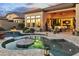 Beautiful backyard pool with cozy outdoor seating and covered patio with views of the home's interior at 8433 E Leonora St, Mesa, AZ 85207