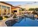Beautiful backyard featuring a refreshing pool, spa, and outdoor seating, perfect for relaxation and entertaining at 8433 E Leonora St, Mesa, AZ 85207