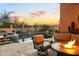 Inviting backyard featuring a pool, spa, fire pit, and cozy seating, perfect for relaxing evenings at 8433 E Leonora St, Mesa, AZ 85207