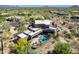 Drone view showcasing a home with a pool, fire pit, and lush desert landscape, blending luxury with nature at 8606 E Arroyo Seco Rd, Scottsdale, AZ 85266
