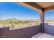 Balcony view showcasing serene desert landscaping and distant mountain views in a picturesque setting at 8606 E Arroyo Seco Rd, Scottsdale, AZ 85266