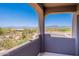 Balcony view featuring scenic desert landscaping and distant mountain views, creating a tranquil outdoor space at 8606 E Arroyo Seco Rd, Scottsdale, AZ 85266