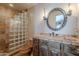 The bathroom features a glass block shower and decorative vanity mirror at 8606 E Arroyo Seco Rd, Scottsdale, AZ 85266