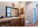 Bathroom boasts decorative vanity with beautiful tiled countertop and dark wood cabinets at 8606 E Arroyo Seco Rd, Scottsdale, AZ 85266