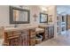 Large bathroom showcasing double sinks, stone countertops, and custom wood cabinetry at 8606 E Arroyo Seco Rd, Scottsdale, AZ 85266