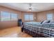 Bright bedroom with natural light, hardwood floors, and multiple windows with scenic views at 8606 E Arroyo Seco Rd, Scottsdale, AZ 85266