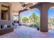 Spacious covered patio area with tile flooring and outdoor seating overlooking the desert landscape at 8606 E Arroyo Seco Rd, Scottsdale, AZ 85266