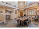 Open concept dining room with large wooden table and southwestern decor at 8606 E Arroyo Seco Rd, Scottsdale, AZ 85266