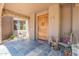 Charming front porch with decorative accents, stone archway, and inviting entrance at 8606 E Arroyo Seco Rd, Scottsdale, AZ 85266