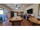 Large game room featuring a pool table, tiled floor, small bar, fireplace, and flat screen TV at 8606 E Arroyo Seco Rd, Scottsdale, AZ 85266
