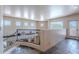 Bright hallway with iron railing, natural light, and tile floors leading to additional living spaces at 8606 E Arroyo Seco Rd, Scottsdale, AZ 85266