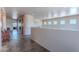 Spacious hallway with tile flooring, recessed lighting, and a curved accent wall at 8606 E Arroyo Seco Rd, Scottsdale, AZ 85266