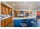 Bright kitchen features generous counter space, island, modern appliances, and ample storage at 8606 E Arroyo Seco Rd, Scottsdale, AZ 85266
