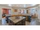 Well-equipped kitchen with an island, stainless steel dishwasher, and seamless flow to dining at 8606 E Arroyo Seco Rd, Scottsdale, AZ 85266