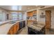 Kitchen features spacious counters, an island, stainless steel dishwasher, and access to outdoor views at 8606 E Arroyo Seco Rd, Scottsdale, AZ 85266