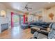 Living room featuring hardwood floors, fireplace, and sliding doors at 8606 E Arroyo Seco Rd, Scottsdale, AZ 85266