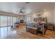Spacious main bedroom with a fireplace, hardwood floors, and access to a private balcony at 8606 E Arroyo Seco Rd, Scottsdale, AZ 85266