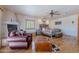 Spacious main bedroom with a stone fireplace, light wood floors, and ample natural light at 8606 E Arroyo Seco Rd, Scottsdale, AZ 85266