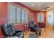 Sitting room with nice view, hardwood floors, and two leather chairs at 8606 E Arroyo Seco Rd, Scottsdale, AZ 85266