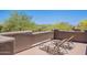 Private patio with lounge chairs offers a relaxing space to enjoy the views and soak up the sun at 8606 E Arroyo Seco Rd, Scottsdale, AZ 85266