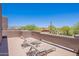Outdoor patio features comfortable lounge chairs, perfect for enjoying the peaceful desert surroundings at 8606 E Arroyo Seco Rd, Scottsdale, AZ 85266