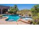 Backyard pool and spa featuring desert views and meticulous desert landscaping at 8606 E Arroyo Seco Rd, Scottsdale, AZ 85266