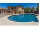 Gorgeous backyard with a private blue pool, patio steps, and a fenced-in yard offering relaxation and entertainment at 8829 W Sheridan St, Phoenix, AZ 85037