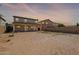 A spacious backyard with a block fence and covered patio is ready for landscaping at 950 E Kelsi Ave, San Tan Valley, AZ 85140