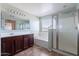 Well-lit bathroom with a shower, bathtub, vanity and tiled floor at 950 E Kelsi Ave, San Tan Valley, AZ 85140