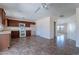 Open concept kitchen with ample counter space, modern appliances, and easy access to dining and living areas at 950 E Kelsi Ave, San Tan Valley, AZ 85140